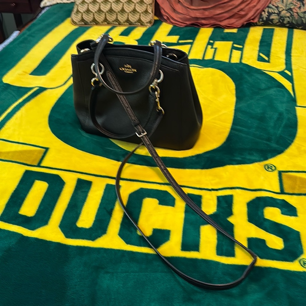 Older, large coach purse. Black leather with gold hardware.